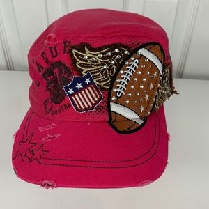 Leader pink women’s hat with some distressing. Adjustable strap football/wings